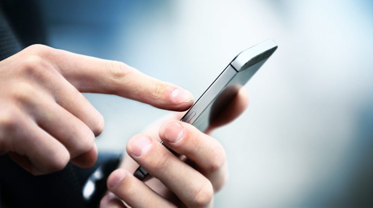 Close up of a man using mobile smart phone Close up of a man using mobile smart phone