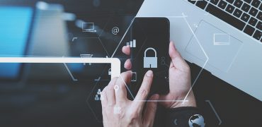 cyber security internet and networking concept.Businessman hand cyber security internet and networking concept.Businessman hand working with VR screen padlock icon mobile phone on laptop computer and digital tablet