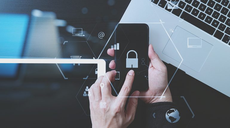 cyber security internet and networking concept.Businessman hand cyber security internet and networking concept.Businessman hand working with VR screen padlock icon mobile phone on laptop computer and digital tablet